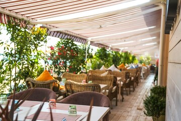 Outdoor cafe in the old town. Summer cafe in the narrow old street
