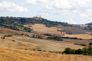 Fototapeta premium San Quirico d' Orcia (SI), Italy - August 05, 2021: Landscape near The Cappella della Madonna di Vitaleta, Tuscany, Italy