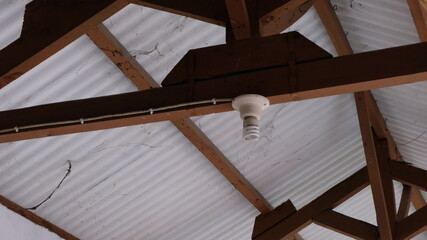 Obraz premium old roof and lamp of a house