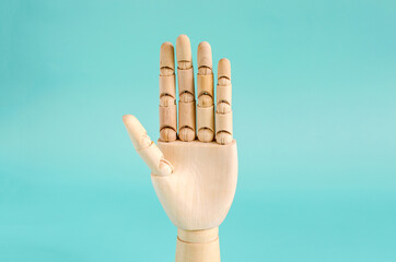 Gesture open palm close-up. The concept of openness and participation is a wooden hand with an open...