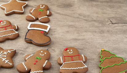 Traditional christmas gingerbread cookies over a wooden table with copy space