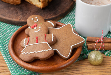 Traditional christmas gingerbread cookies over a wooden table