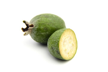 Feijoa fruit or whole and half pineapple guava isolated on white