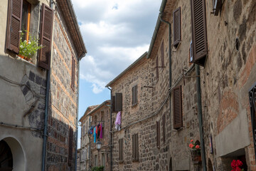 Fototapeta na wymiar Radicofani (SI), Italy - August 15, 2021: Radicofani village and houses view, Tuscany, Italy