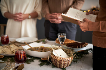 Close up of family praying in Christmas Eve