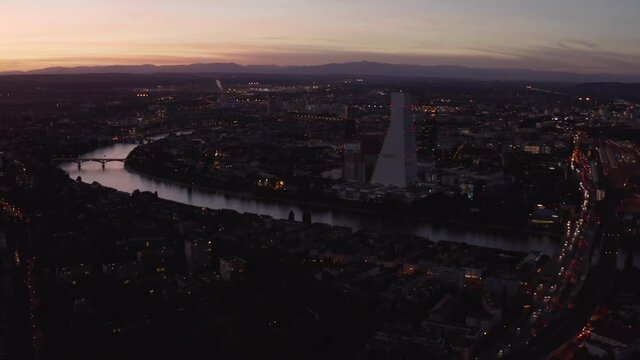 Aerial showing Basel City with the Rhine and Roche tower after Sunset