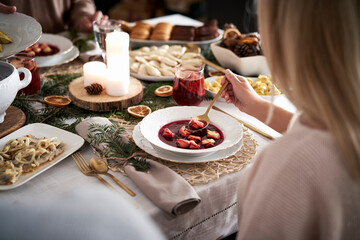 Woman eating traditional Christmas soup