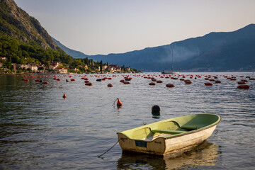 Fototapeta na wymiar Fishing boat on an oyster farm in the Bay of Kotor, Montenegro