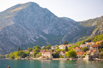 Fototapeta na wymiar Fishing village on mountain background in Montenegro