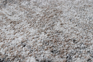 Beige and grey fabric texture carpet background . Carpet background closeup.