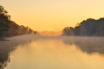 Obraz na płótnie Canvas MISTY MORNING fishing sun in the haze