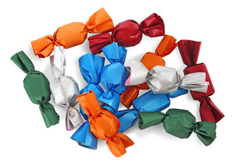 Many candies in colorful wrappers on white background, top view