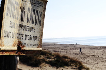 old sign on the beach