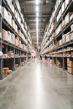 Large furniture warehouse,,Rows of shelves with boxes	