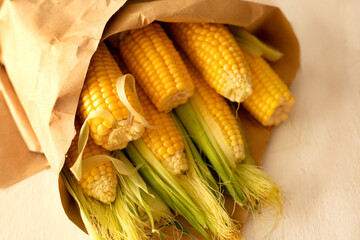Corn in craft paper as a bouquet