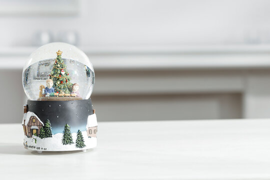 Glass Christmas music box and empty space on a wooden table 