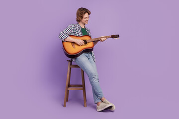 Full size photo of young guy happy positive smile enjoy guitarist concert isolated over violet...