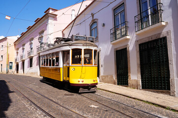 Fototapeta na wymiar Vintage yellow tram in the middle of street
