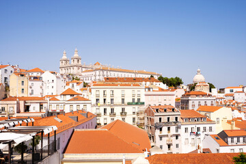 Fototapeta premium Panoramic view of the buildings of a downtown with an ancient monastery