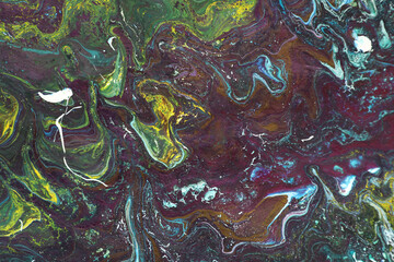 Liquid marble paint background. Liquid painting abstract texture. A colorful combination of acrylic dark and vibrant colors. Paper marbling is a method of aqueous surface design