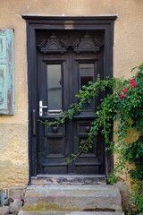 Fototapeta na wymiar Old gray wooden door