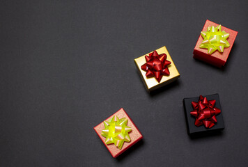 Black Friday sale. Stylish gift boxes lie on a black background. Flat lay, top view, copy space.