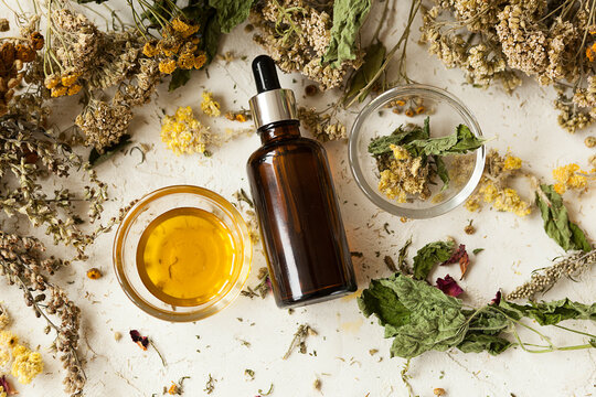 cosmetic oil from herbal extract in a bottle, natural cosmetics, beauty treatments
