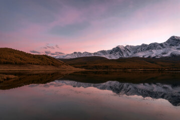 Fototapeta na wymiar mountains lake sunset reflection clouds autumn