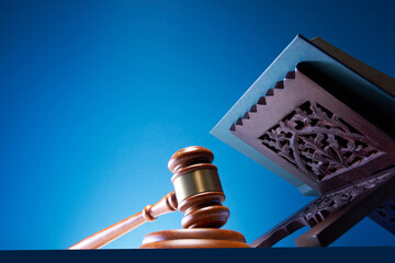  gavel hammer and Quran or holy book of Muslim