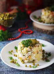 Olivier salad, traditional Russian dish, served on the plate	 for New Year dinner