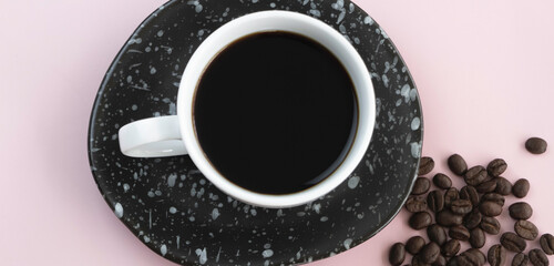 White ceramic cup with black coffee put on background