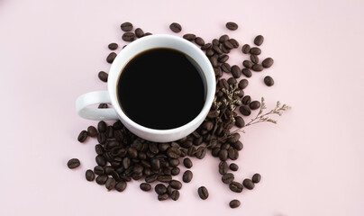 White ceramic cup with black coffee put on background