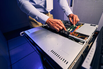 Data center IT professional removing components from server