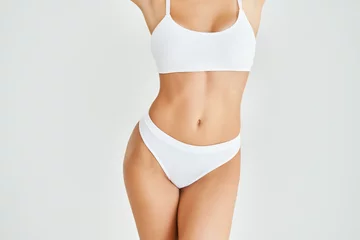 Papier Peint photo autocollant Fitness Perfect sporty body in white underwear of young woman