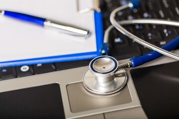 Stethoscope and Clipboard on Computer Keyboard