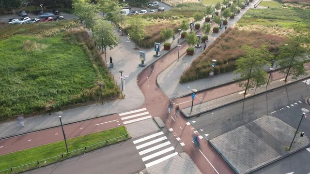 Bustling rush hour activity on street, cyclists and pedestrians, timelapse