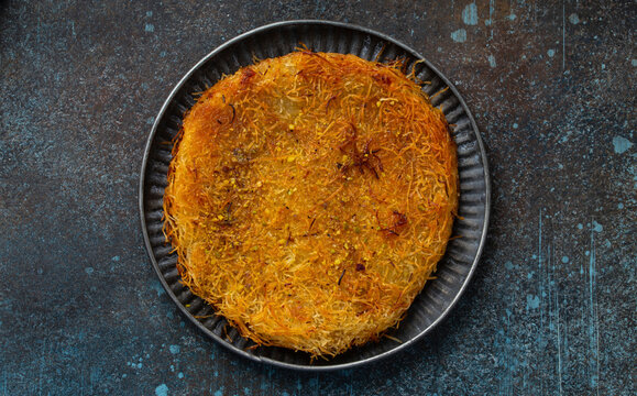 K�nefe (knafeh) - traditional Turkish dessert pastry made of filo filled with cheese and syrup
