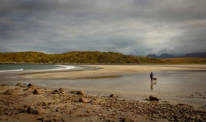 person walking on the beach