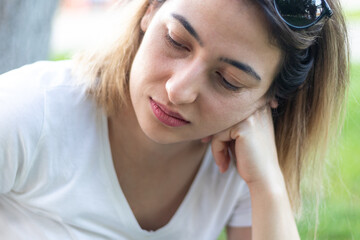 Fototapeta premium Young woman feeling sad while wandering outside. Stress and depression concept.