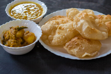 delicious Indian food Puri or luchi with potato curry  and gram.