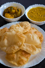 delicious Indian food Puri or luchi with potato curry  and gram.