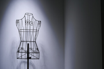 Stylish wire tailor's mannequin isolated on white