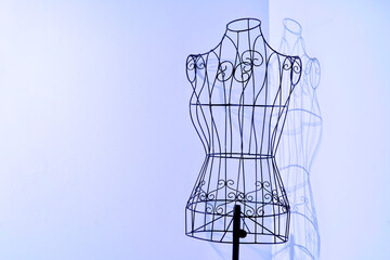 Stylish wire tailor's mannequin with shadow