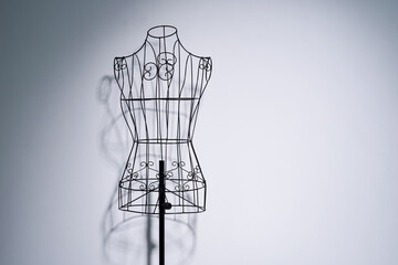 Stylish wire tailor's mannequin isolated on white