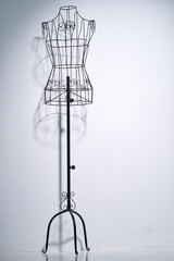 Stylish wire tailor's mannequin isolated on white