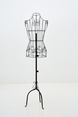 Stylish wire tailor's mannequin isolated on white