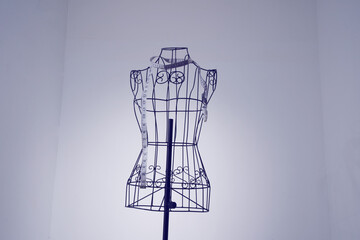 Stylish wire tailor's mannequin isolated on white