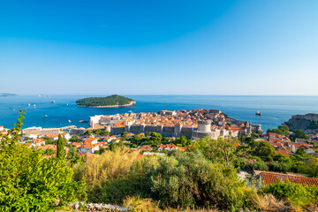Fototapeta na wymiar Panorama cityscape view of old town Dubronik. Famous ancient city with big city walls and beautiful architecture is great tourist destination in Croatia.Old city of Dubrovnik is part of UNESCO