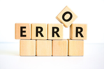 Error symbol. The concept word 'error' on wooden cubes on a beautiful white table, white background. Business and error concept. Copy space.
