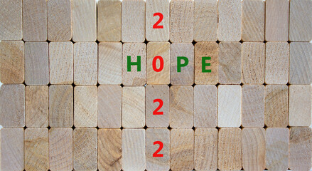 2022 hope new year symbol. Wooden blocks with words 'Hope 2022'. Beautiful wooden background, copy space. Business, 2022 hope new year concept.